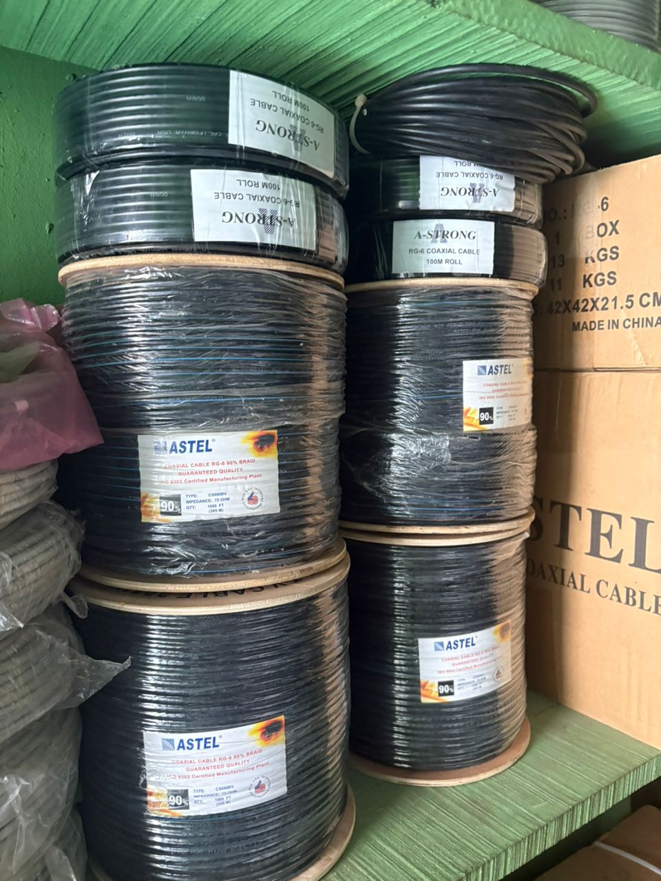 Shelved spools of black coaxial cable