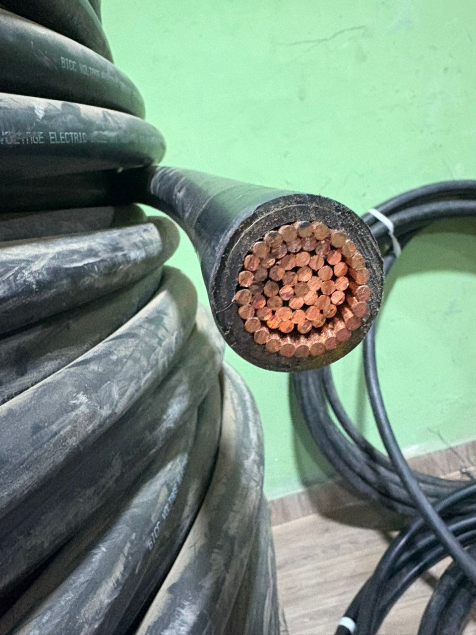 Close-up of a heavy electrical cable showing copper conductors