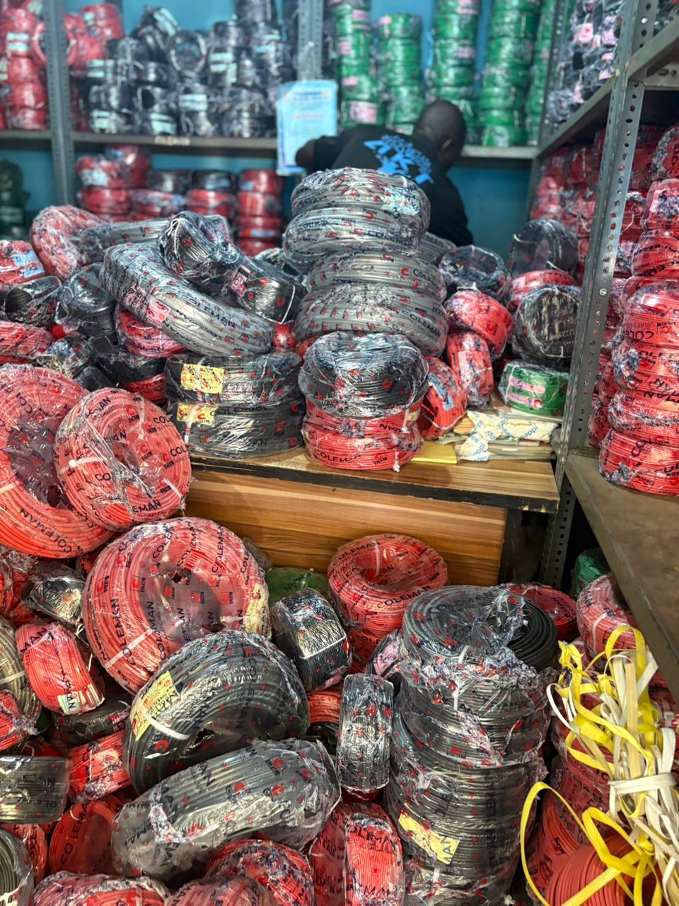 Stacks of bundled electrical cable coils in the C-DEJEK warehouse
